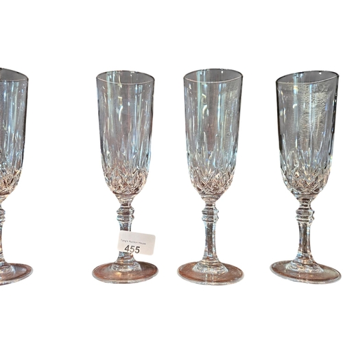 455 - A collection of 10 cut crystal champagne flutes