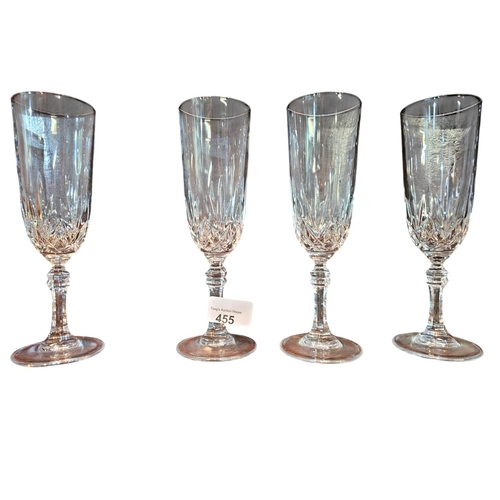 455 - A collection of 10 cut crystal champagne flutes