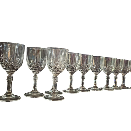 457 - Collection of 11 cut glass small wine / sherry glasses