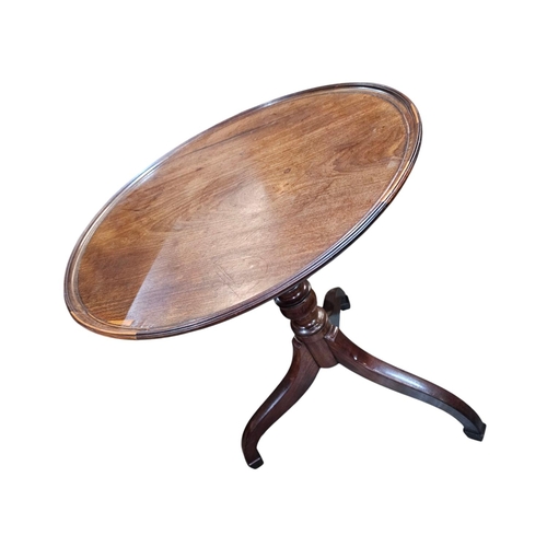 478 - A late Georgian fruitwood tilt top wine table