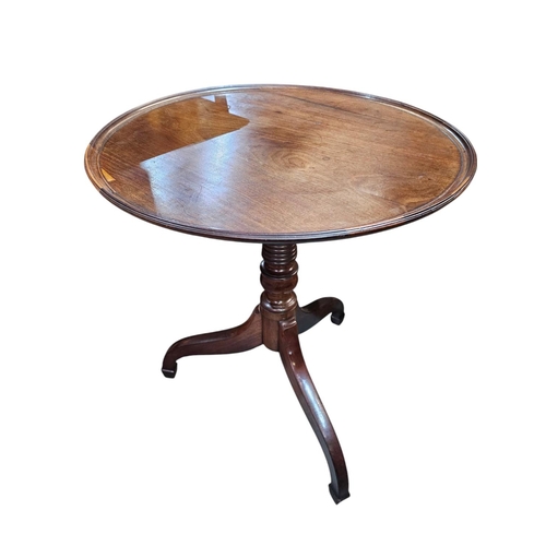 478 - A late Georgian fruitwood tilt top wine table