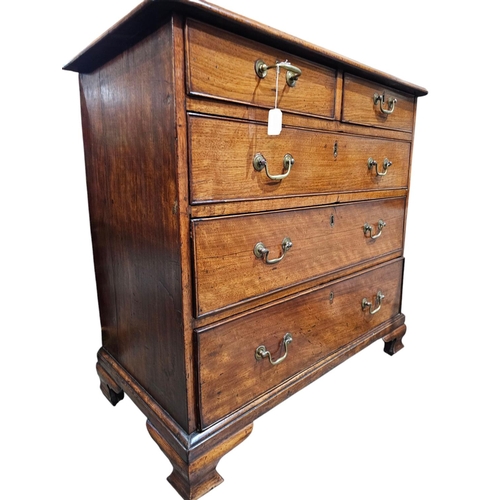 486 - A George III mahogany chest of 2 short and 3 long, graduating drawers, the moulding to the re entran... 