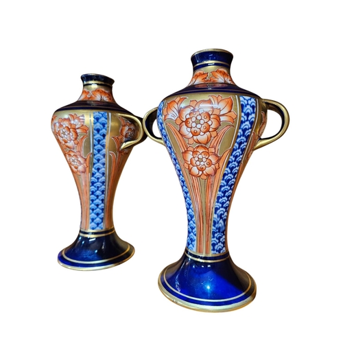 488 - A stunning pair of  Moorcroft MacIntyre, twin handle vases of inverted ballaster form painted in und... 