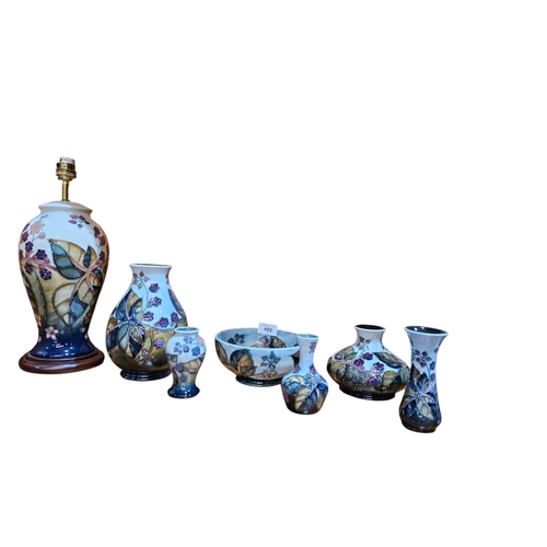 492 - William Moorcroft pottery, the bramble pattern 8 pieces in total including 2 lamps large blaster vas... 