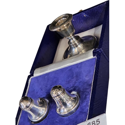 685 - Cased set of fully hallmarked salt and pepper set and candle holder