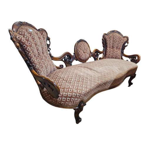 695 - A Victorian walnut double end settee with elaborate pierced and carved scrolling show frame with aca... 