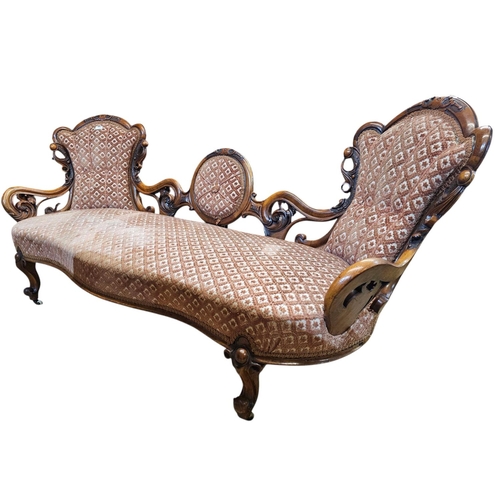 695 - A Victorian walnut double end settee with elaborate pierced and carved scrolling show frame with aca... 