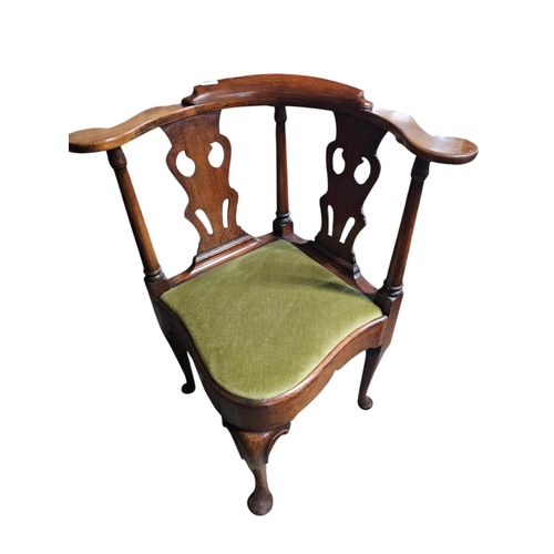 699 - A George The Third mahogany elbow chair, the unusual back with three wavy pierced black horizontal s... 