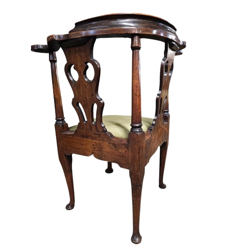 699 - A George The Third mahogany elbow chair, the unusual back with three wavy pierced black horizontal s... 