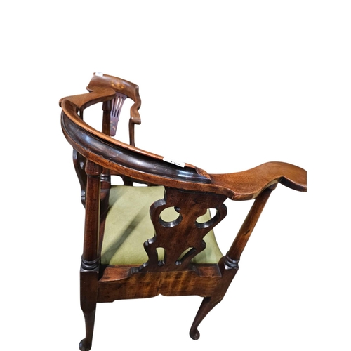 699 - A George The Third mahogany elbow chair, the unusual back with three wavy pierced black horizontal s... 