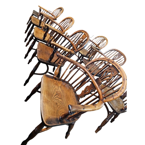 706 - A Harlequin set of 10 Victorian yew wood  Windsor elbow chairs each with low back centered by a pier... 