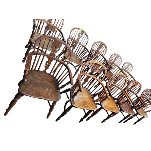 706 - A Harlequin set of 10 Victorian yew wood  Windsor elbow chairs each with low back centered by a pier... 