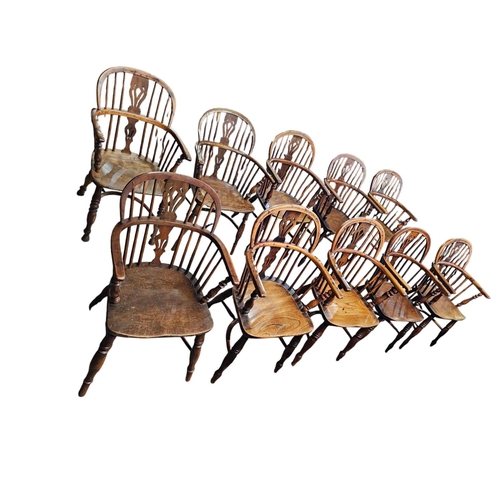 706 - A Harlequin set of 10 Victorian yew wood  Windsor elbow chairs each with low back centered by a pier... 