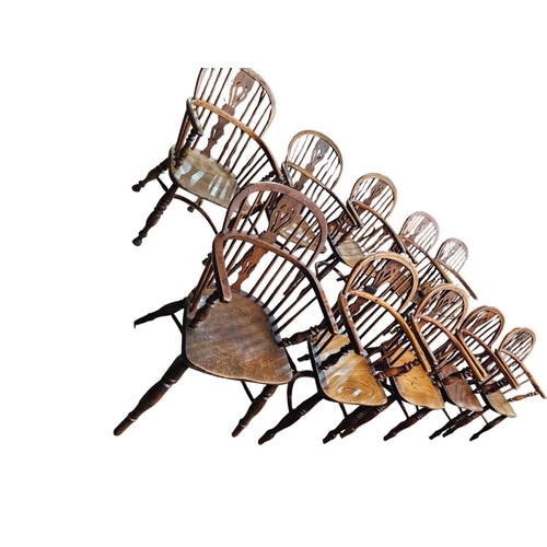 706 - A Harlequin set of 10 Victorian yew wood  Windsor elbow chairs each with low back centered by a pier... 