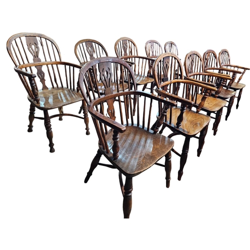 706 - A Harlequin set of 10 Victorian yew wood  Windsor elbow chairs each with low back centered by a pier... 