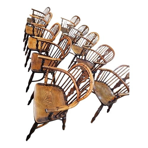 706 - A Harlequin set of 10 Victorian yew wood  Windsor elbow chairs each with low back centered by a pier... 