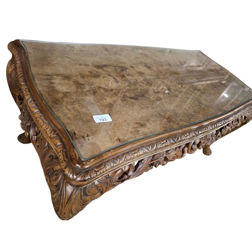 723 - A quality carved antique walnut table with glass top