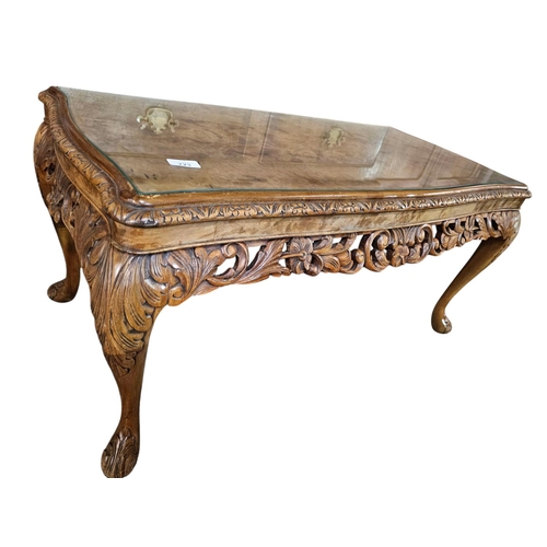 723 - A quality carved antique walnut table with glass top