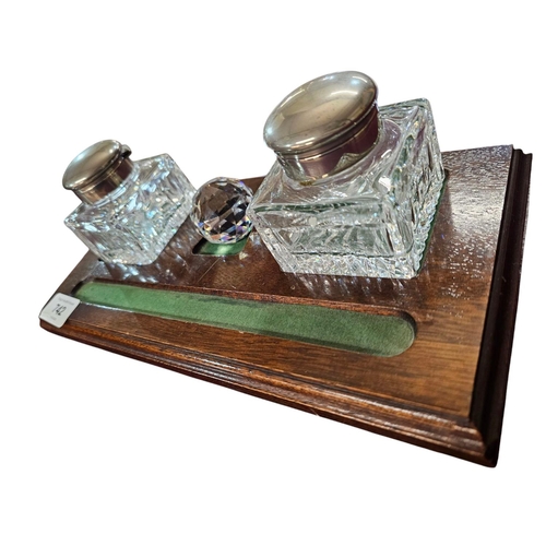 742 - Inkwell set on wooden plinth with 2 glass inkwells with plated tops