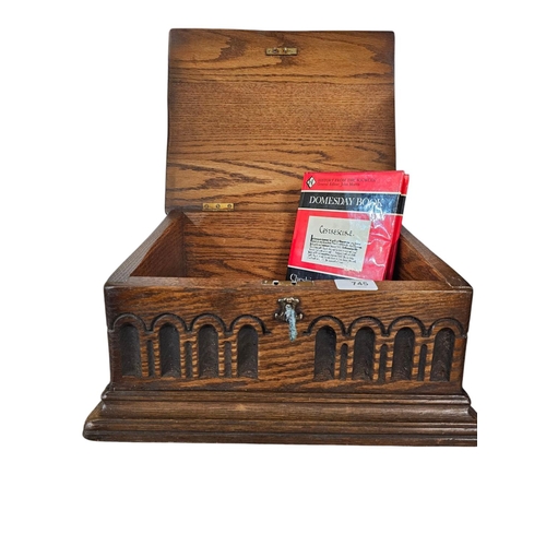 745 - Decorative wooden box to match lot 728 with key including the Doomsday certificate and Doomsday book