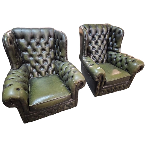 759 - A pair of Green deep buttons wing back Chesterfield Chairs