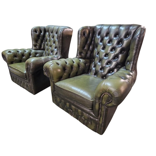 759 - A pair of Green deep buttons wing back Chesterfield Chairs