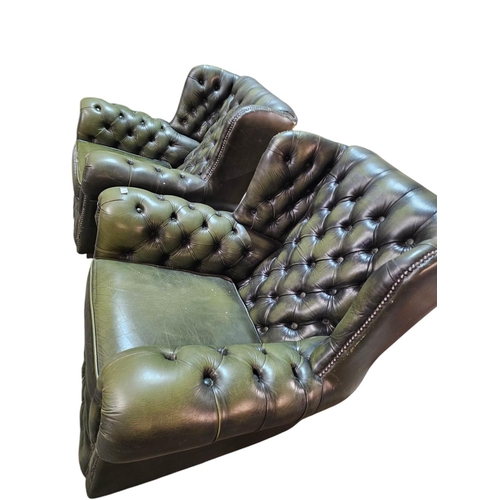 759 - A pair of Green deep buttons wing back Chesterfield Chairs