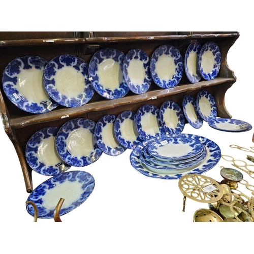 113 - Antique flow plate set with it's signature blurred cobalt blue design. Stamped Regent England