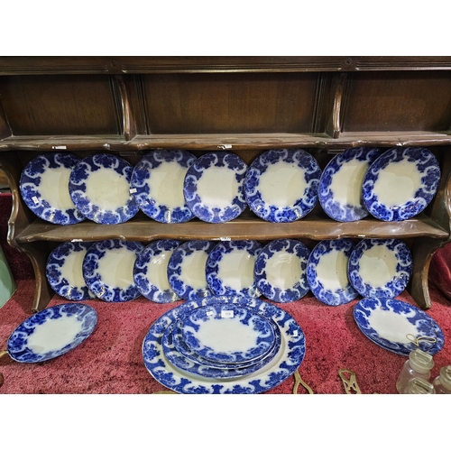 113 - Antique flow plate set with it's signature blurred cobalt blue design. Stamped Regent England