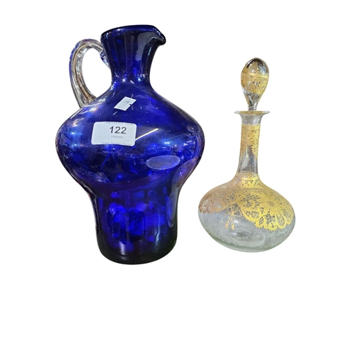 122 - Heavy blue glass jug with clear glass handle together with decorative Italian glass bottle with stop... 