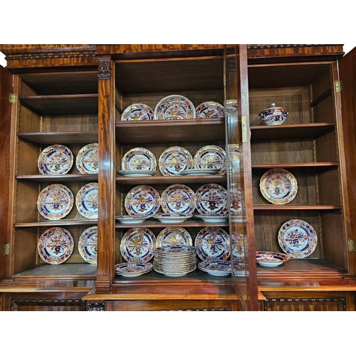 413 - A early 19th century Derby porcelain Imari dinner service of indented form, comprising a twin handle... 