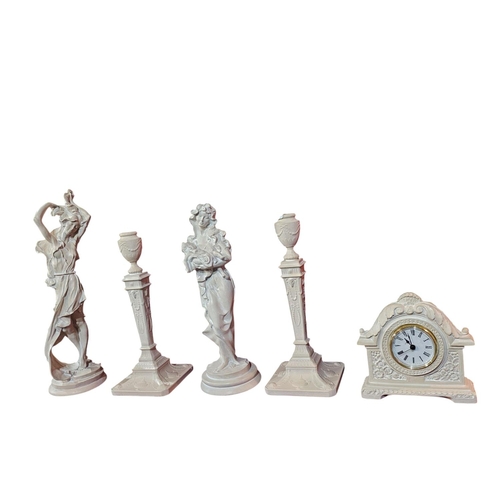 452 - Hand cast figurines 2 candle stick holders and quartz clock