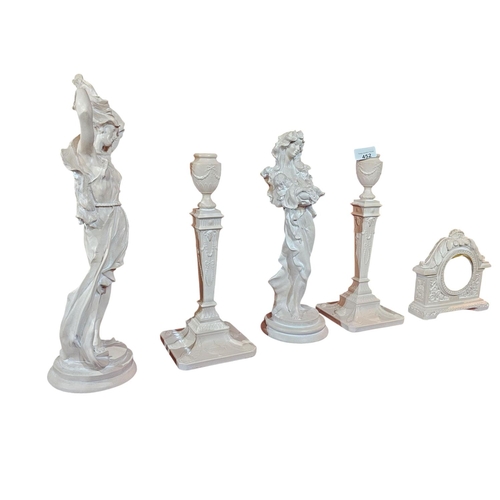 452 - Hand cast figurines 2 candle stick holders and quartz clock