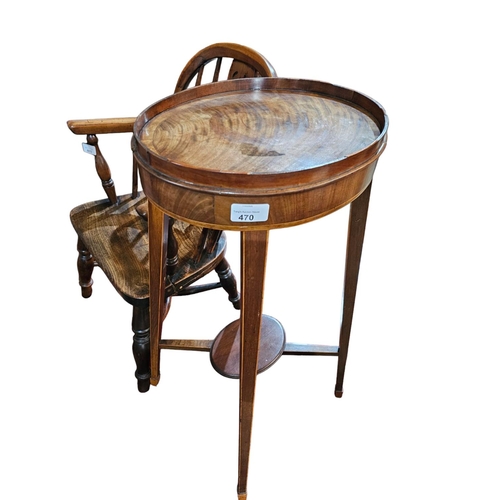 470 - A George III mahogany and cross banded kettle stand the Oval top with raised gallery surround raised... 