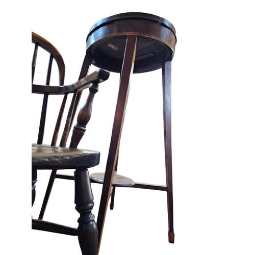 470 - A George III mahogany and cross banded kettle stand the Oval top with raised gallery surround raised... 