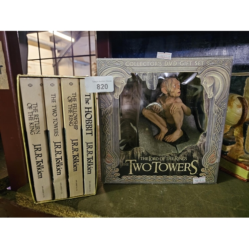 820 - A boxed set of the Lord of the Rings Trilogy together with The Hobbit. Also a Two Towers collectible... 