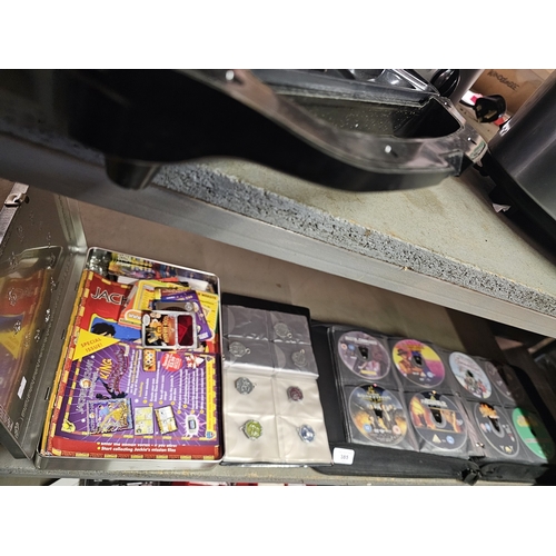 385 - JACKIE CHAN ADVENTURES TIN FULL OF CARDS, GAMES, ETC PLUS VERY LARGE COLLECTION OF DVD'S
