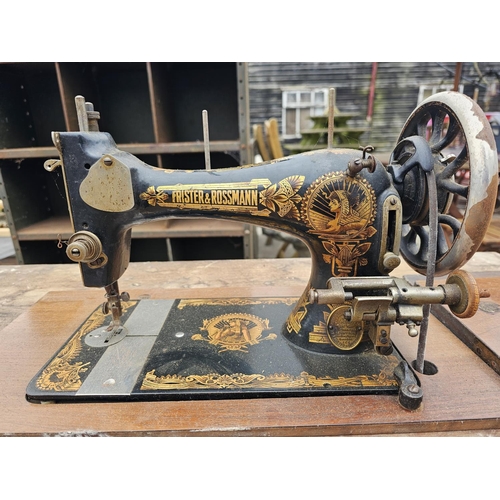 309 - FRUSTER & ROSSMAN VIBRATING SHUTTLE TREADLE SEWING MACHINE, EARLY 20th CENTURY HOUSED IN WOODEN CABI... 