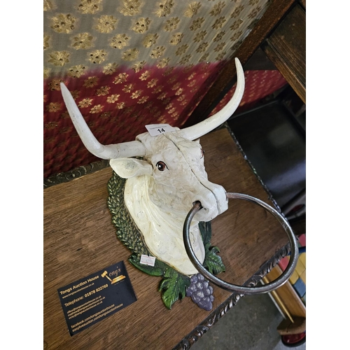 14 - A cast metal bulls head with ring
