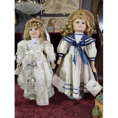 144 - Two collectible porcelain dolls