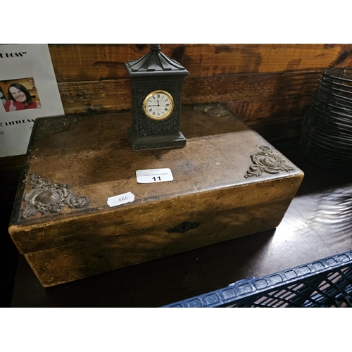 11 - antique wooden box, adorned with ornate metal corner embellishments and a decorative lock plate. Als... 