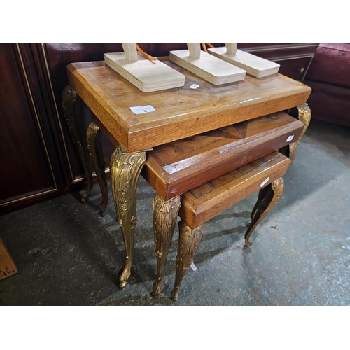 6 - Nest of wooden tables with ornate brass legs and inlaid marquetry