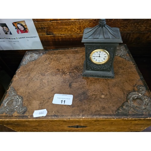 11 - antique wooden box, adorned with ornate metal corner embellishments and a decorative lock plate. Als... 