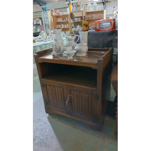 51 - vintage oak cabinet featuring a traditional linenfold design on the cupboard doors.