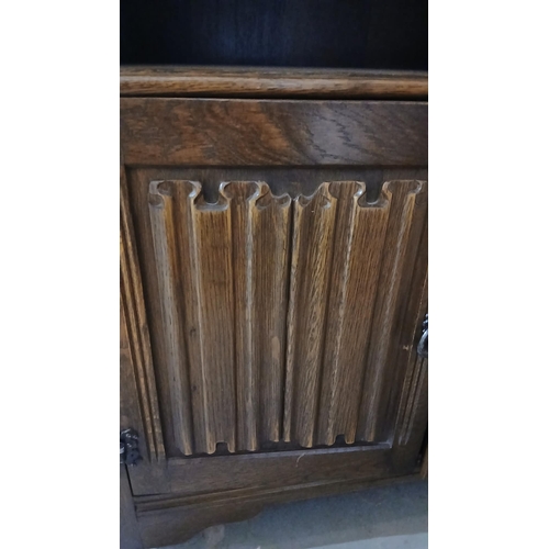 51 - vintage oak cabinet featuring a traditional linenfold design on the cupboard doors.