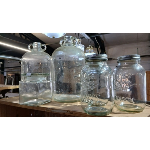 78 - a collection of vintage glass items, including several large demijohn bottles with ring handles and ... 