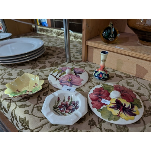 82 - Nice collection of pottery to include Old Tupton ware bud vase, Moorcroft pottery lids