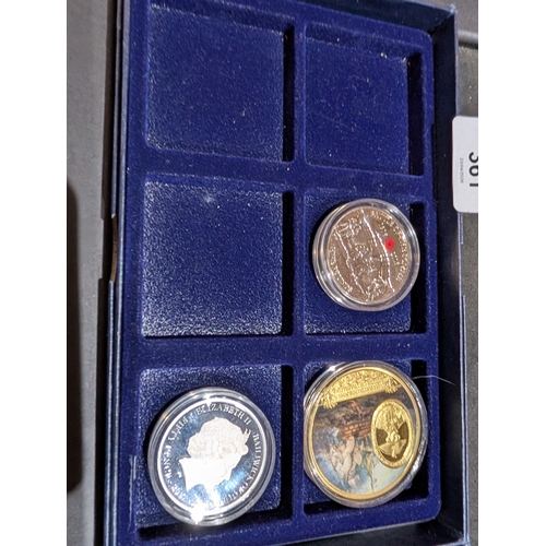 361 - commemorative coins housed in a display case