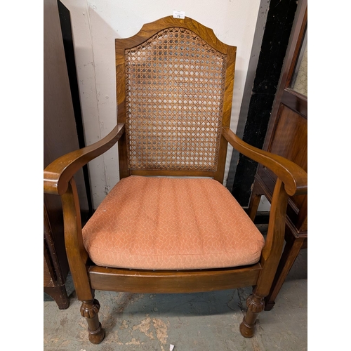 79L - Shield cane back Bergere style mid-century chair with pink upholstered seat cushion