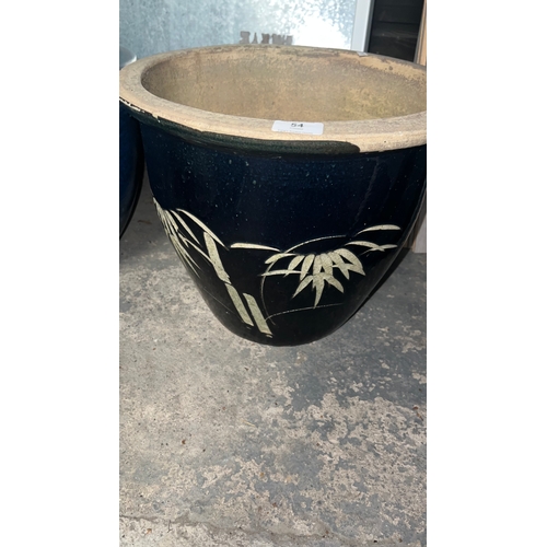 54 - Large glazed navy plant pot with palm leaf design, 32 cm height
